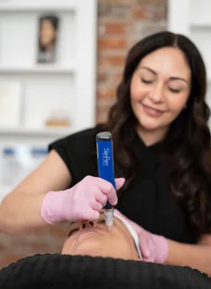 Client receiving Microneedling facial treatment at Pure Beauty Aesthetics