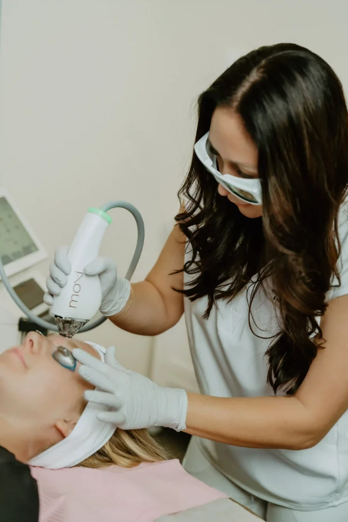 Aesthetician Giving Moxi Laser Treatment to Patient at Pure Beauty Aesthetics in Albany, OR
